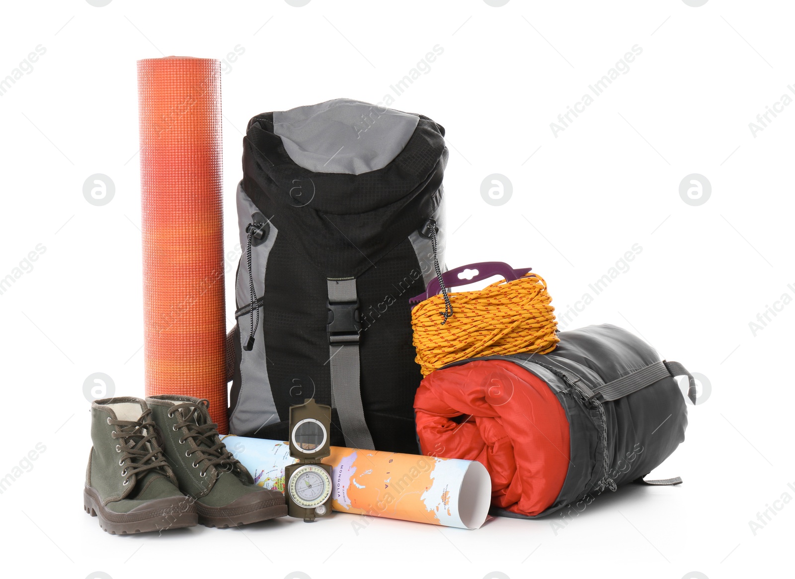 Photo of Set of camping equipment with sleeping bag on white background