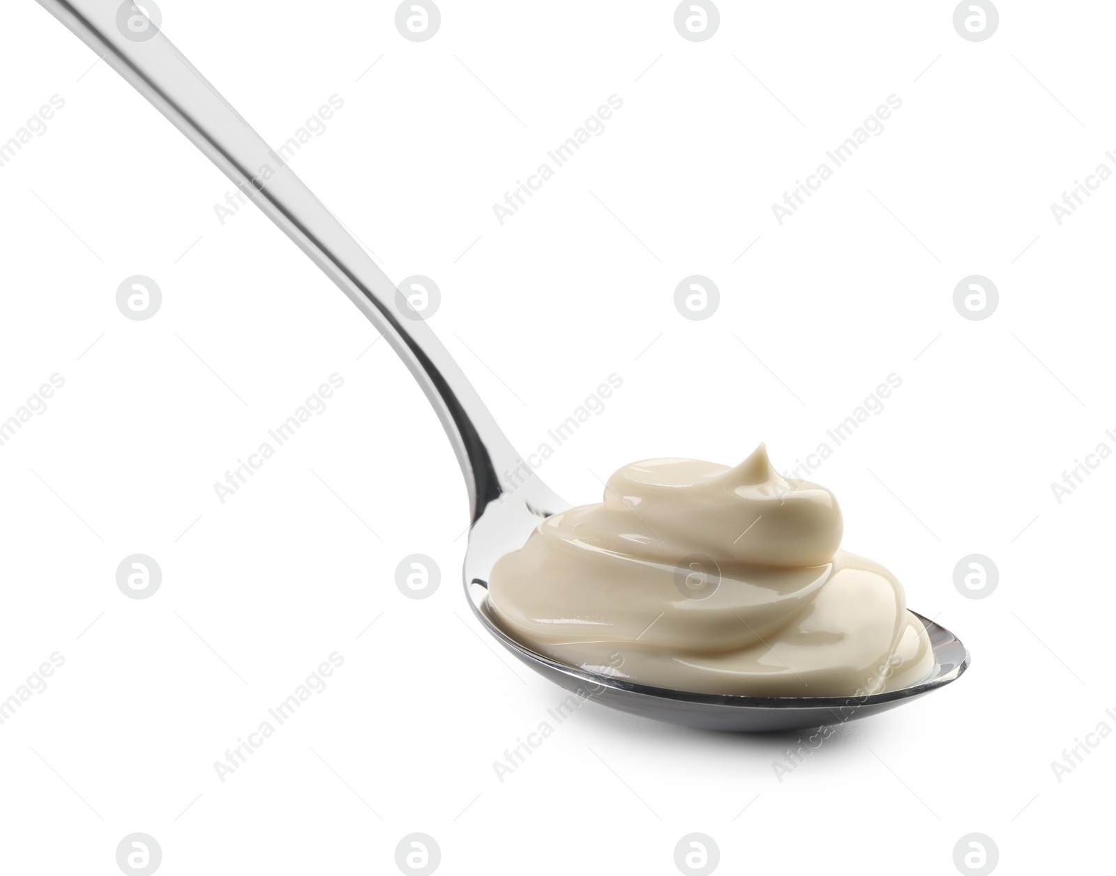 Photo of Natural yogurt in spoon isolated on white