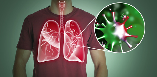 Man with diseased lungs on dark background