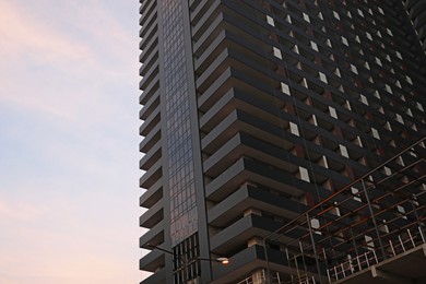 Beautiful skyscraper against blue sky, low angle view