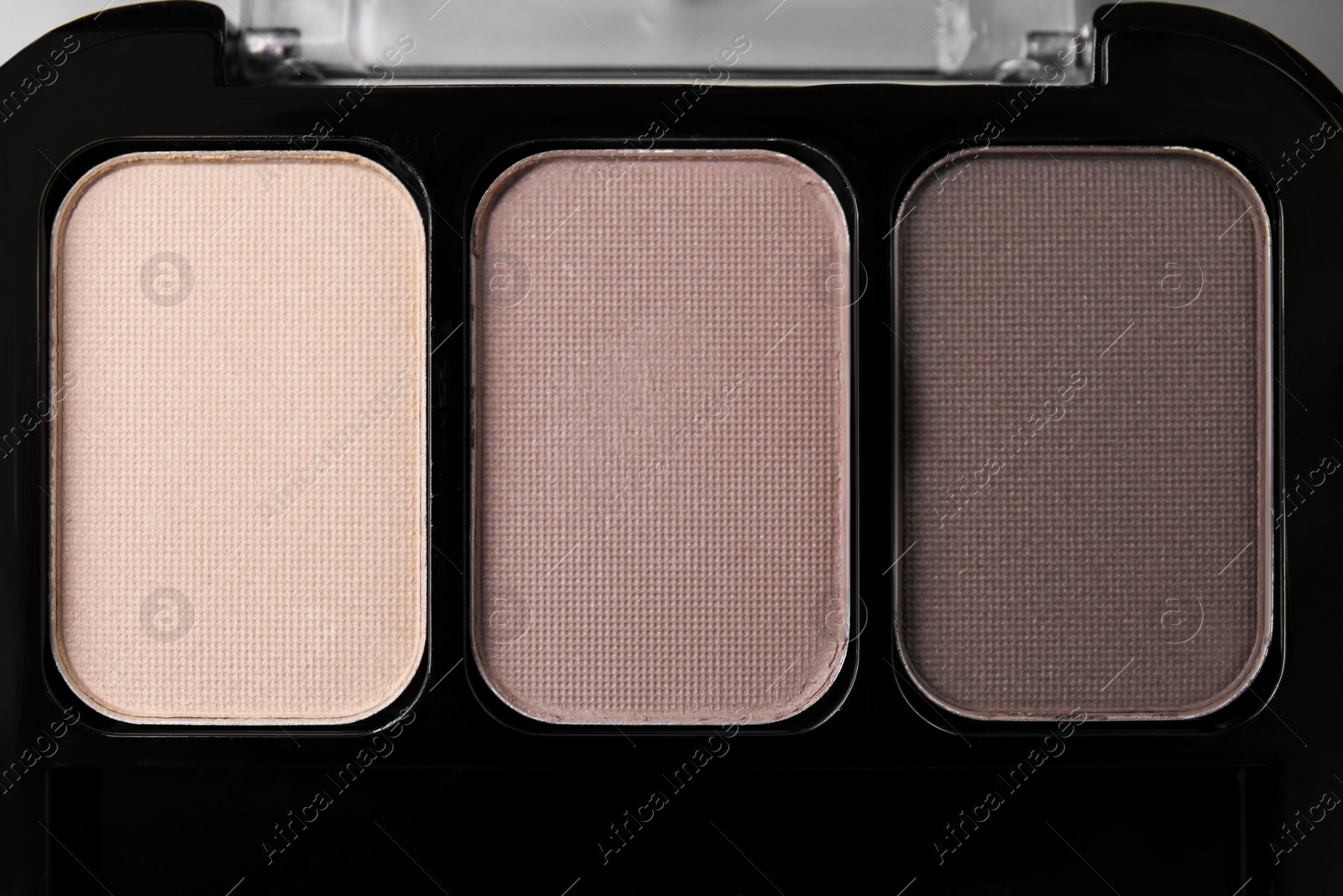 Photo of Beautiful eyeshadow palette as background, top view. Professional cosmetic product