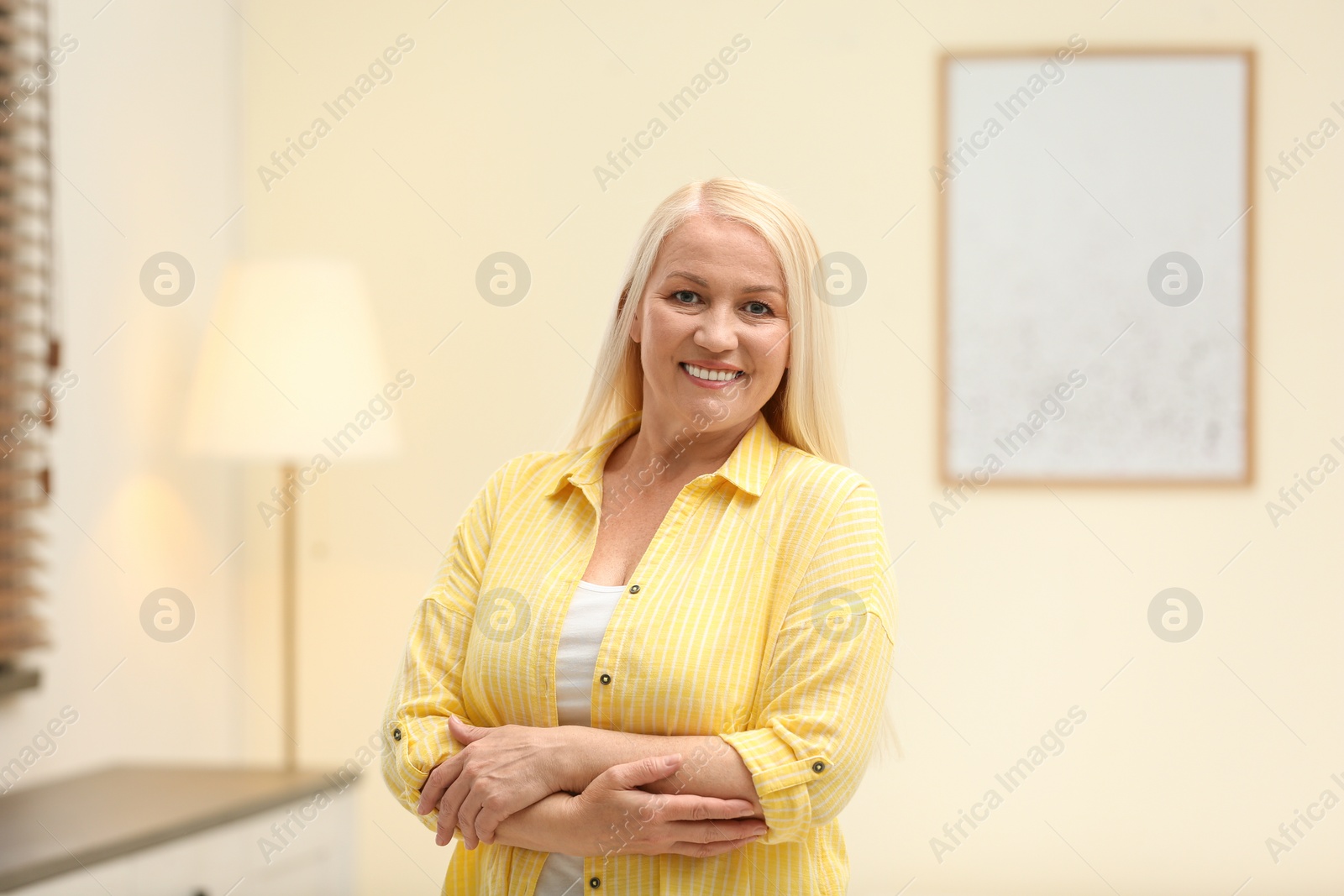 Photo of Portrait of happy mature woman at home