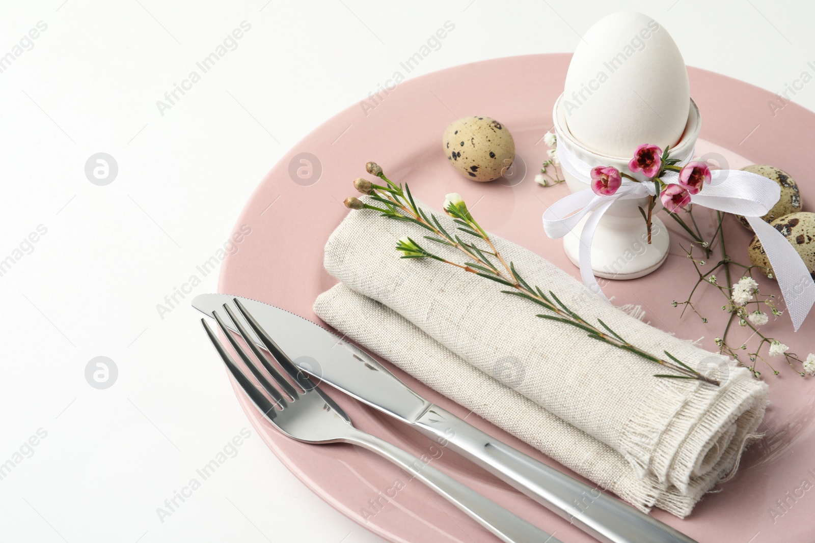 Photo of Festive Easter table setting with beautiful floral decor, closeup