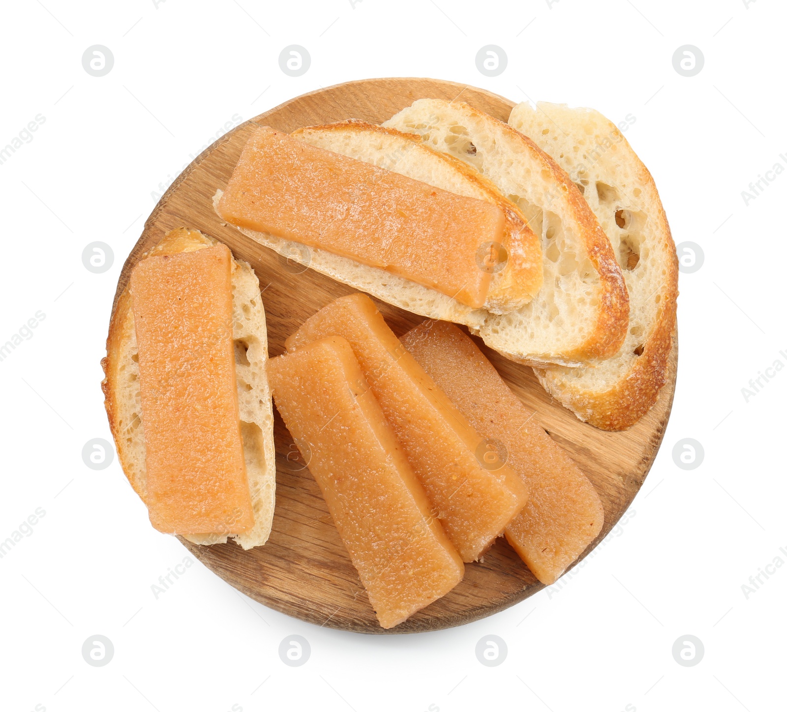 Photo of Delicious sweet quince paste and bread isolated on white, top view