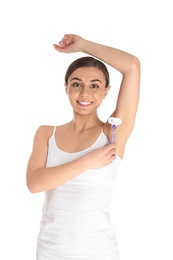 Photo of Beautiful young woman shaving armpit on white background