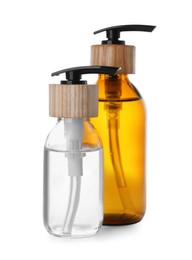 Photo of Bottles with dispenser caps on white background
