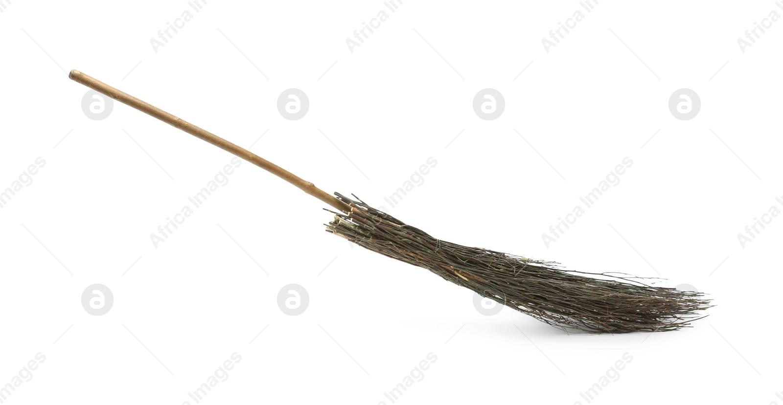 Photo of Old broom with wooden handle isolated on white