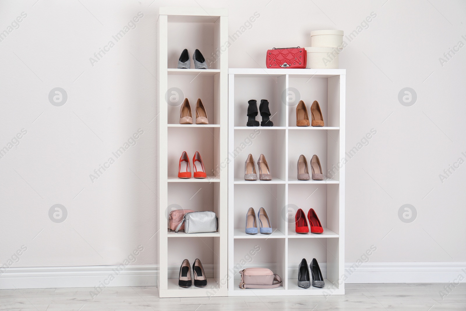 Photo of Wardrobe shelves with different stylish shoes indoors. Idea for interior design