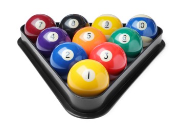 Photo of Plastic rack with billiard balls on white background