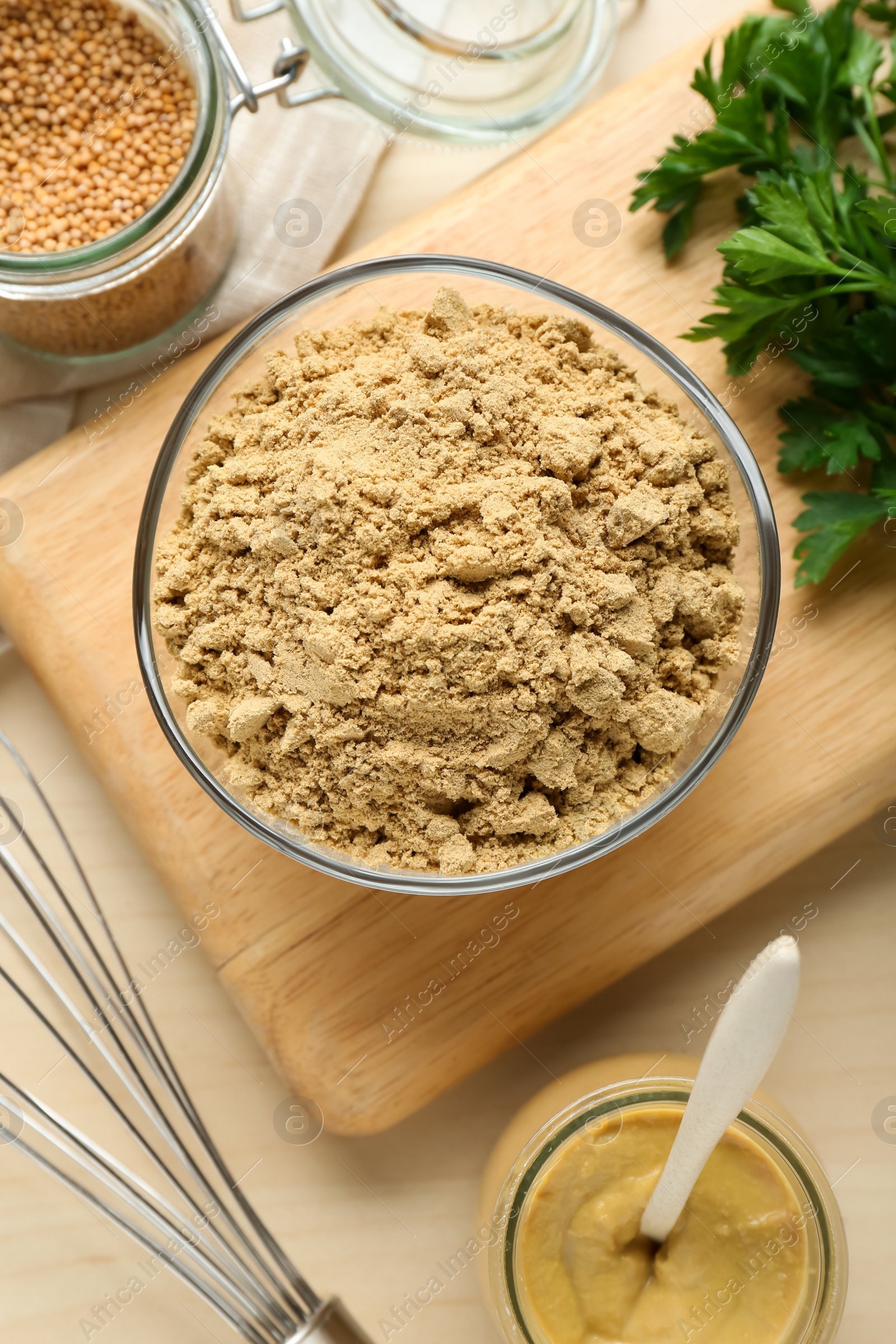 Photo of Flat lay composition with aromatic mustard powder on wooden table