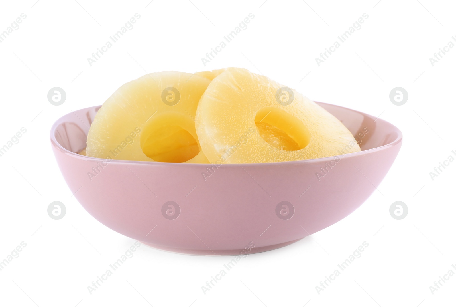 Photo of Delicious canned pineapple rings in bowl on white background