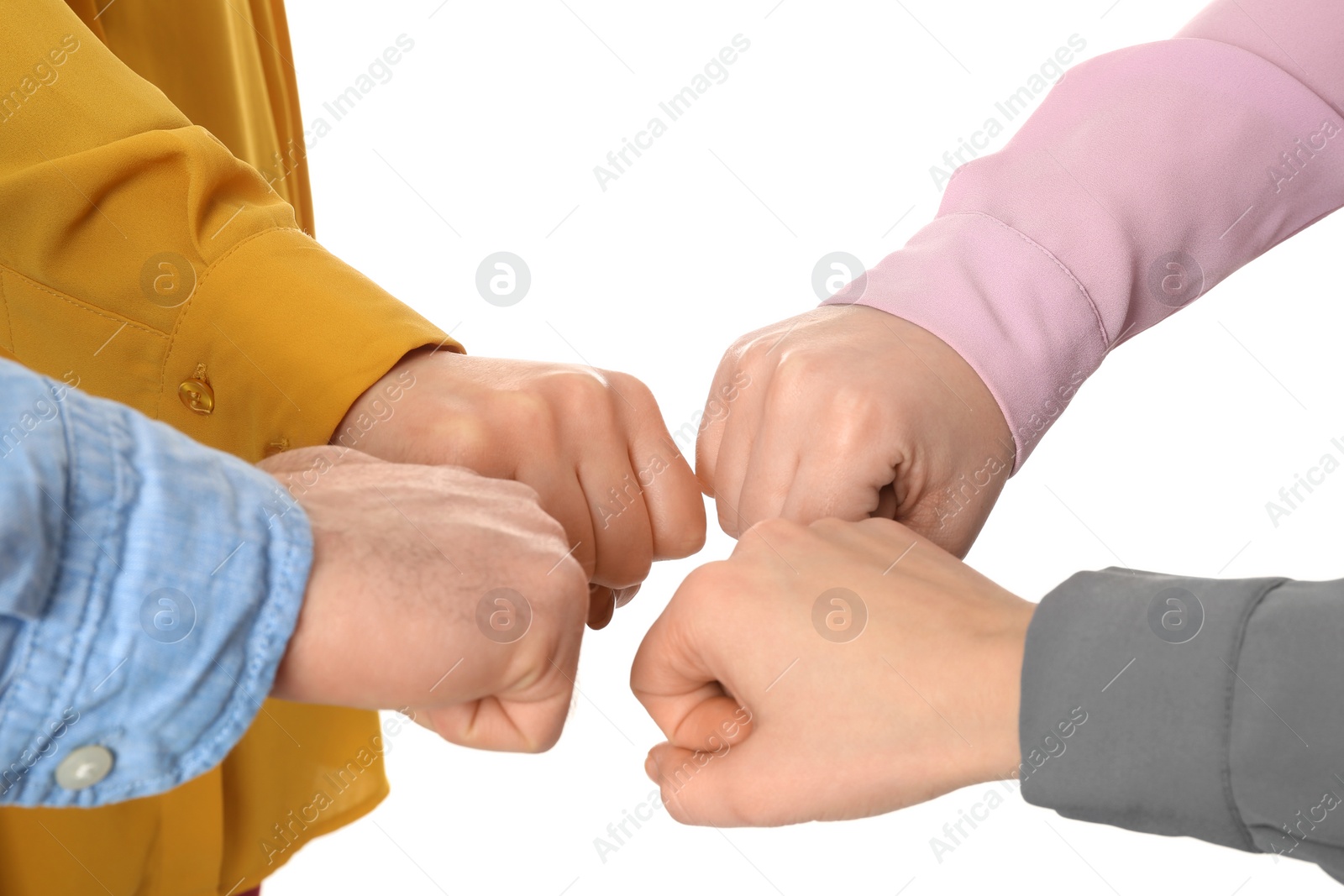 Photo of Young people putting their hands together on white background, closeup