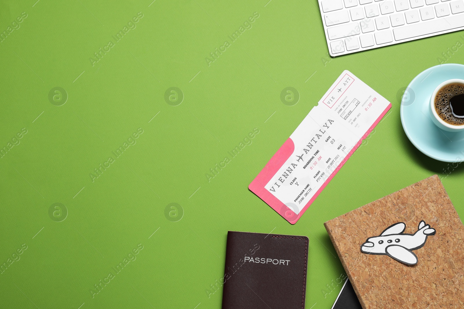 Photo of Flat lay composition with passport, cup of coffee and ticket on green table, space for text. Business trip