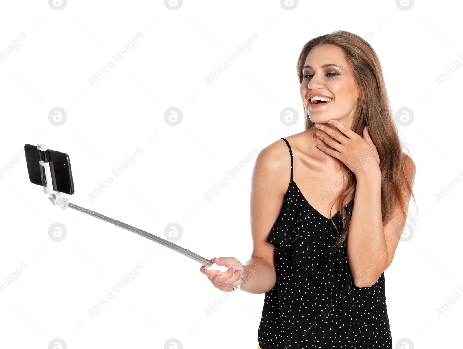 Photo of Happy young woman taking selfie on white background