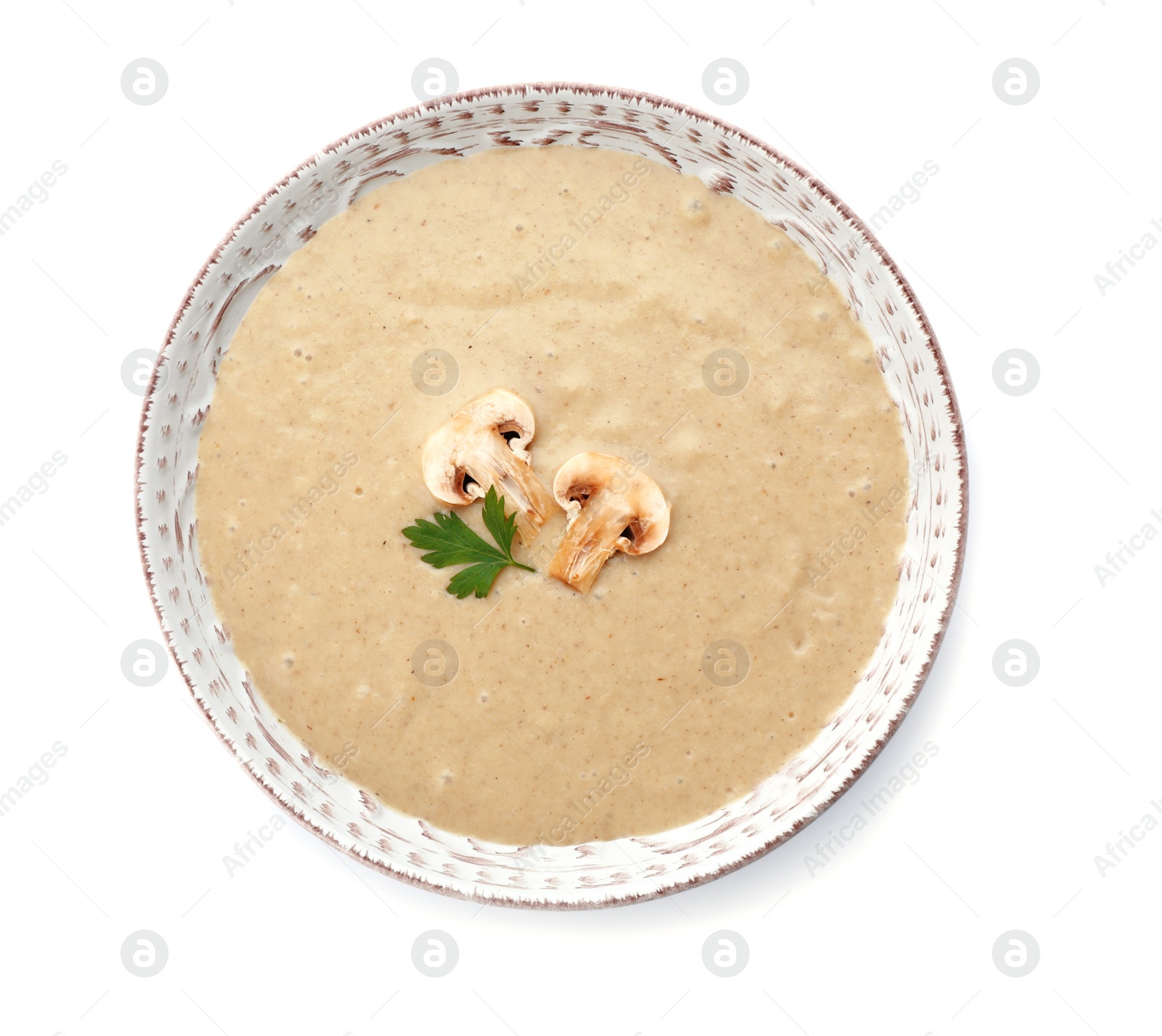 Photo of Bowl of fresh homemade mushroom soup on white background, top view