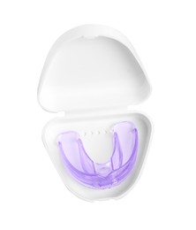 Photo of Container with transparent dental mouth guard isolated on white, top view. Bite correction