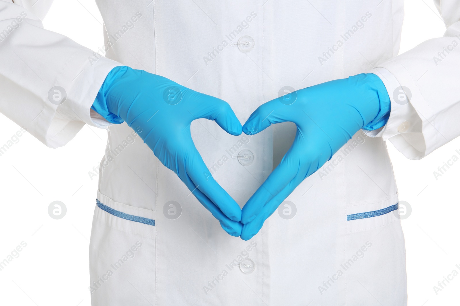 Photo of Doctor making heart shape with hands in medical gloves on white background