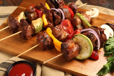 Delicious shish kebabs served on table, closeup