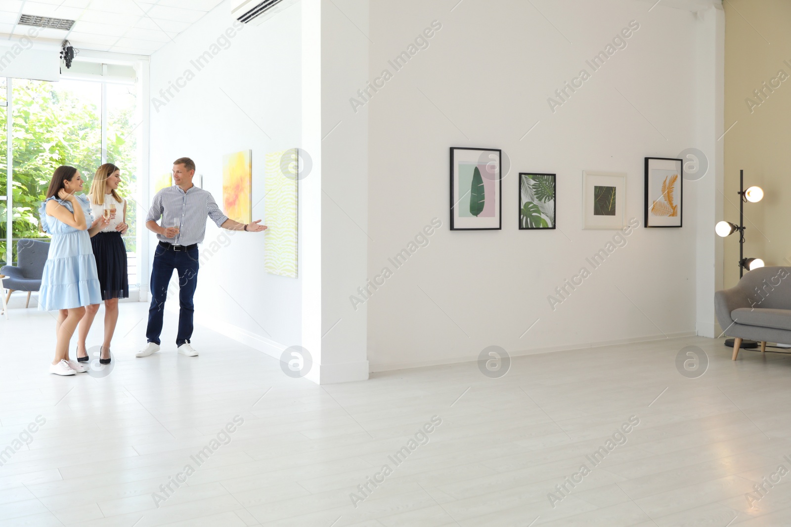 Photo of Group of people at exhibition in art gallery