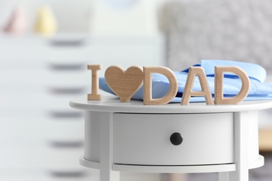Photo of Phrase "I love dad" on table. Father's day celebration