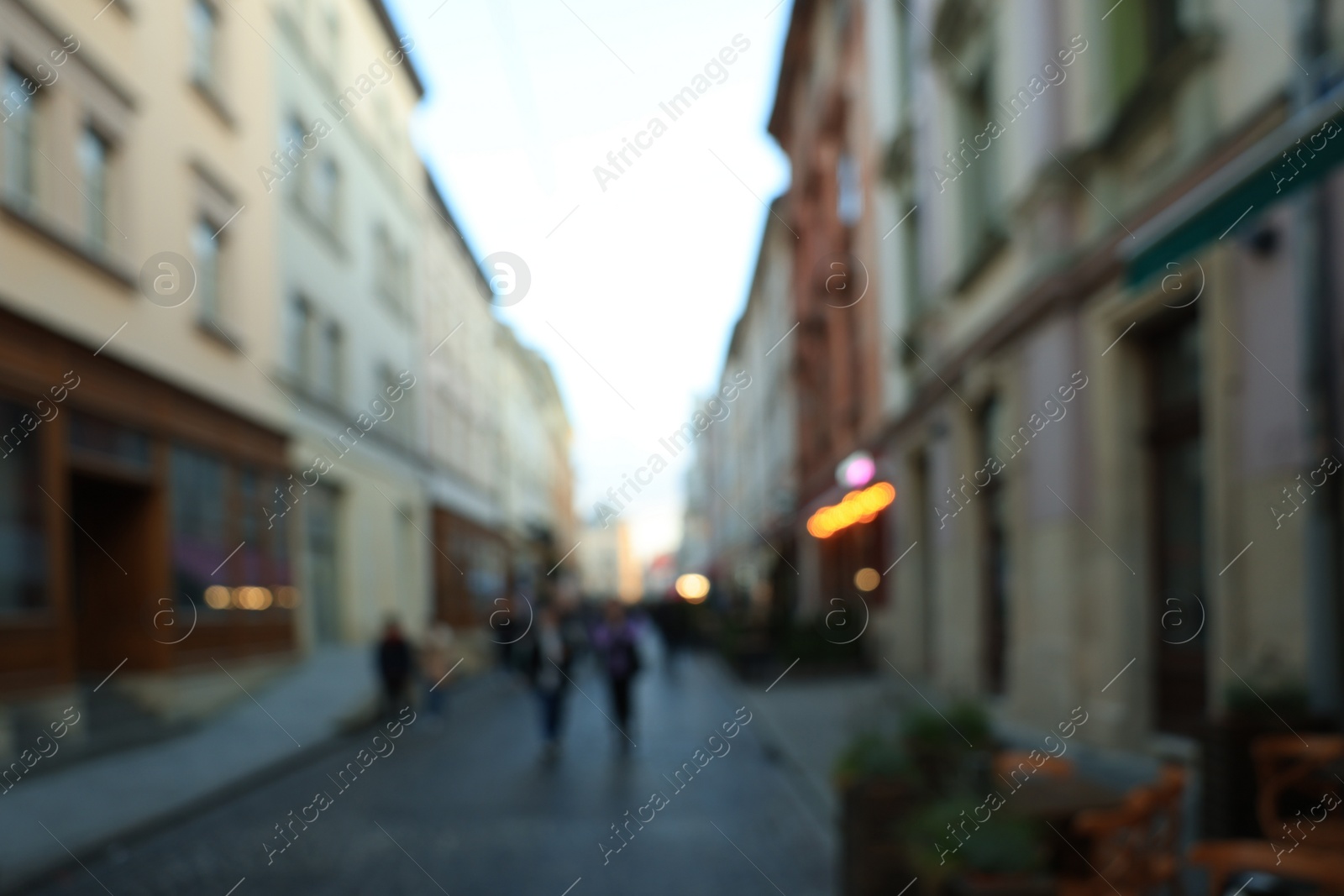 Photo of Blurred view of people walking on city street