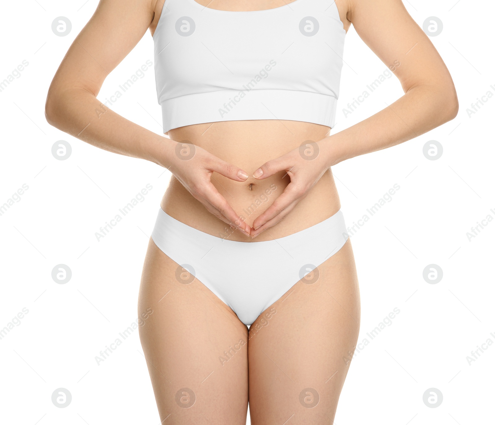 Photo of Gynecology. Woman in underwear making heart with her hands on white background, closeup