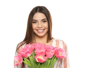 Photo of Portrait of smiling young girl with beautiful tulips on white background. International Women's Day