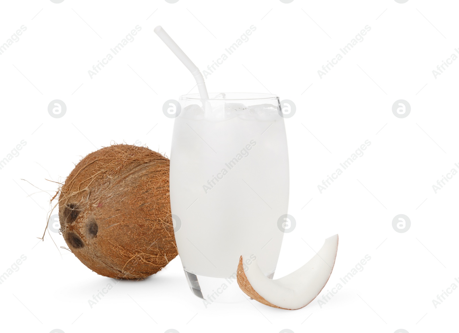 Photo of Glass of coconut water, ice cubes and nuts isolated on white