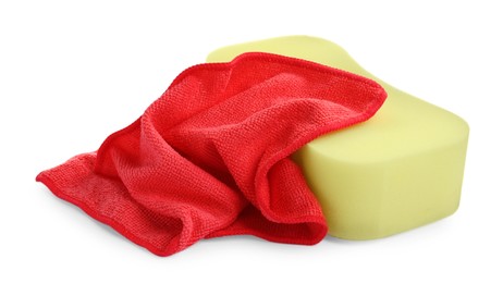 Photo of Sponge and car wash cloth on white background