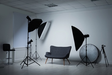 Modern photo studio with professional lighting equipment