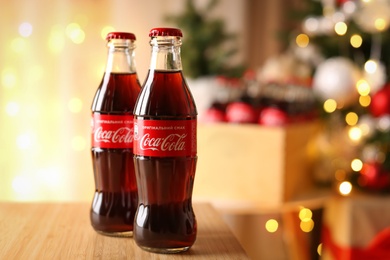 MYKOLAIV, UKRAINE - JANUARY 18, 2021: Coca-Cola bottles on table in room