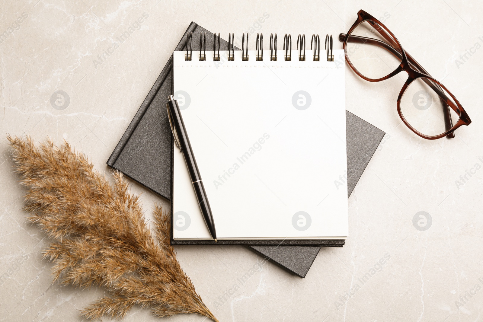 Photo of Flat lay composition with stylish notebooks on marble table