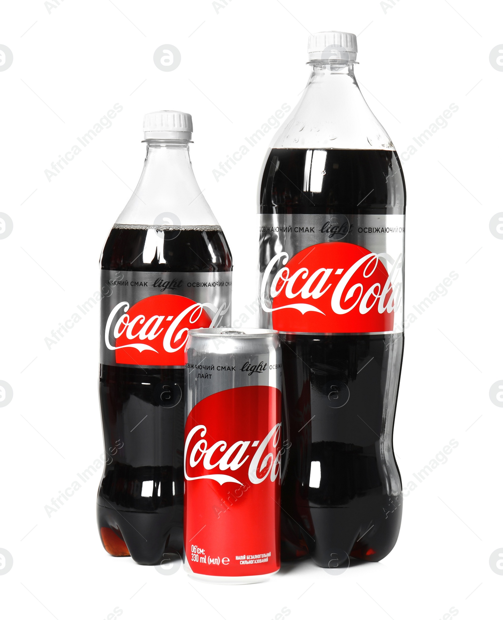 Photo of MYKOLAIV, UKRAINE - NOVEMBER 14, 2018: Coca-Cola can and bottles on white background