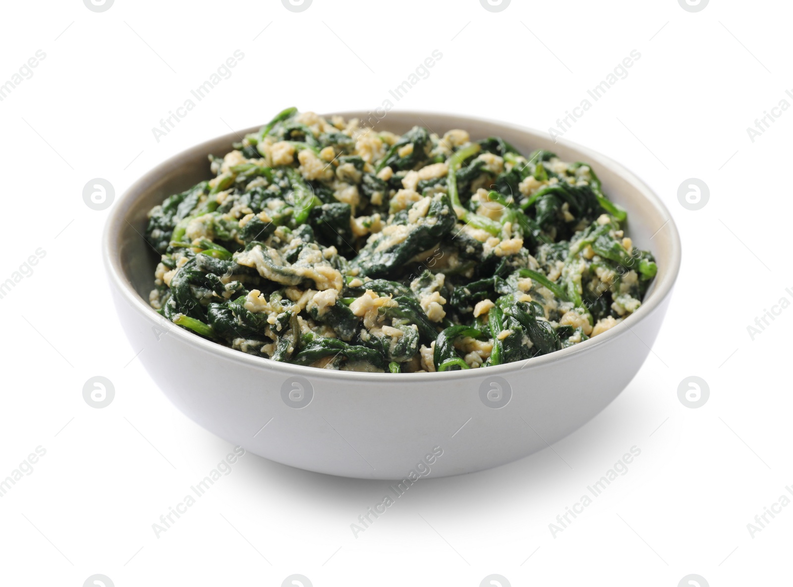 Photo of Tasty spinach dip with egg in bowl isolated on white