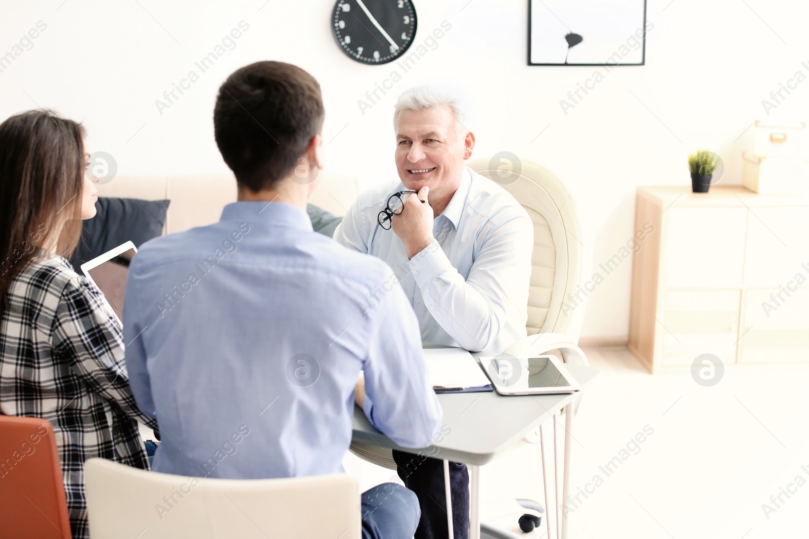 Photo of Human resources commission conducting job interview with applicant in office