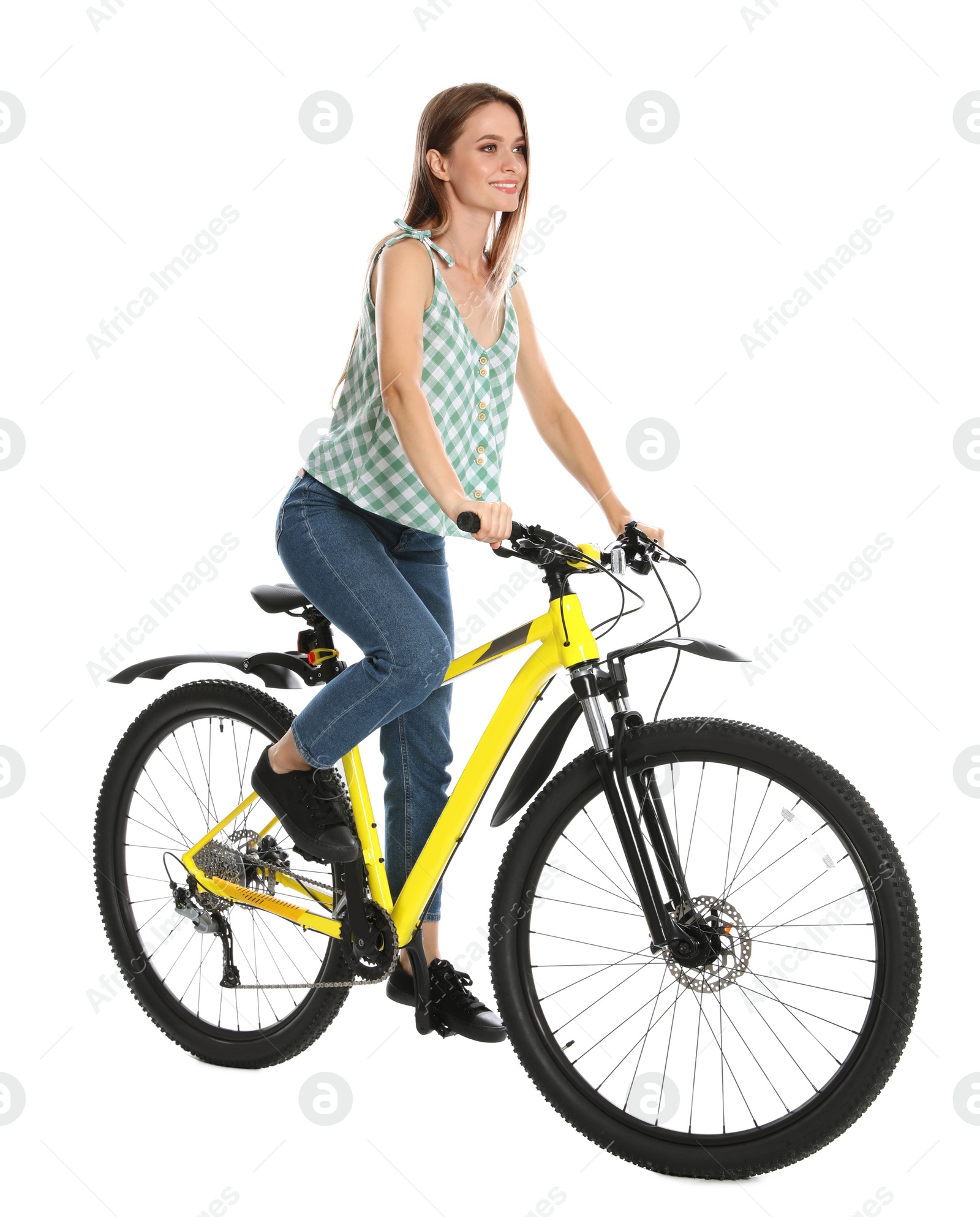 Photo of Happy young woman riding bicycle on white background