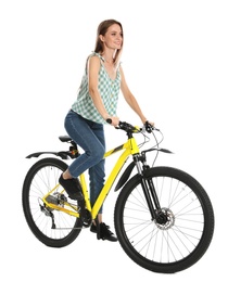 Photo of Happy young woman riding bicycle on white background