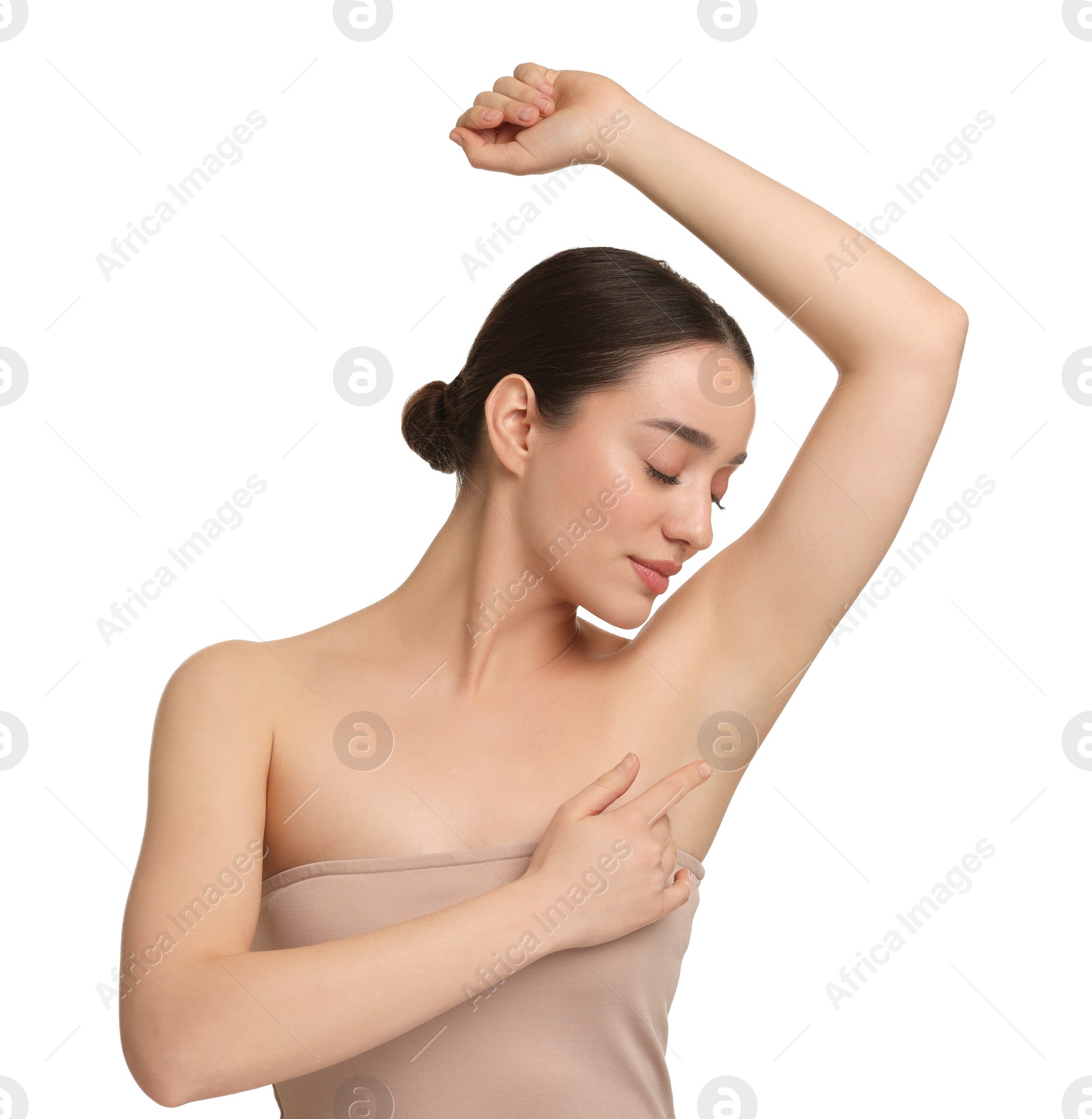 Photo of Beautiful woman showing armpit with smooth clean skin on white background