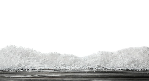 Wooden surface covered with snow against white background