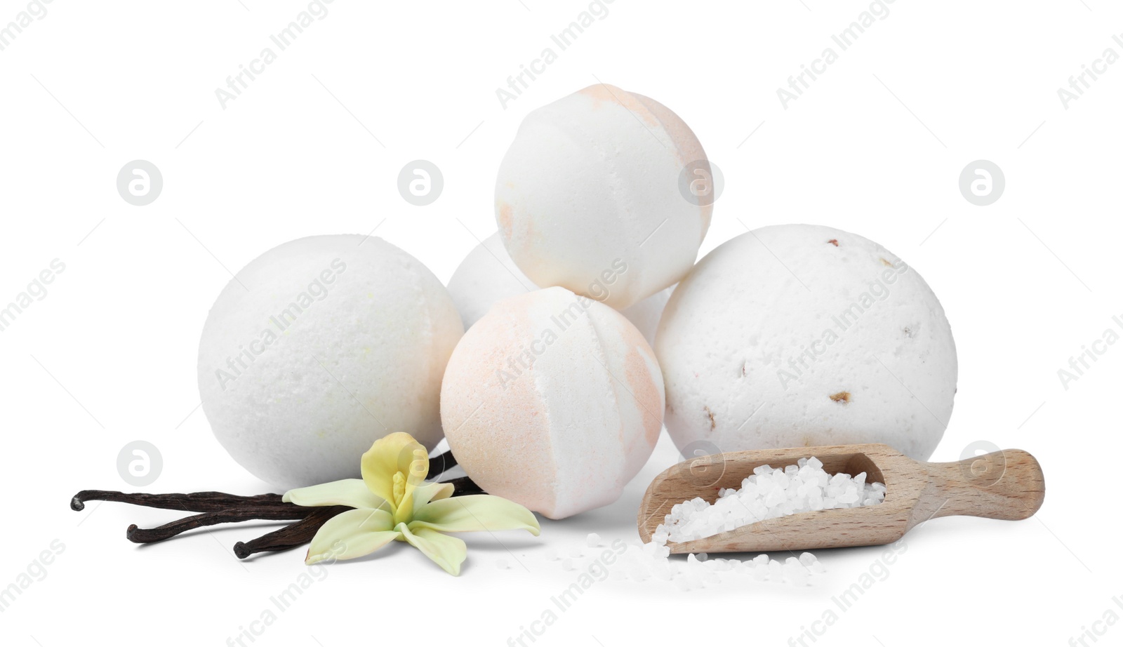 Photo of Fragrant bath bombs, salt, vanilla sticks and flower on white background