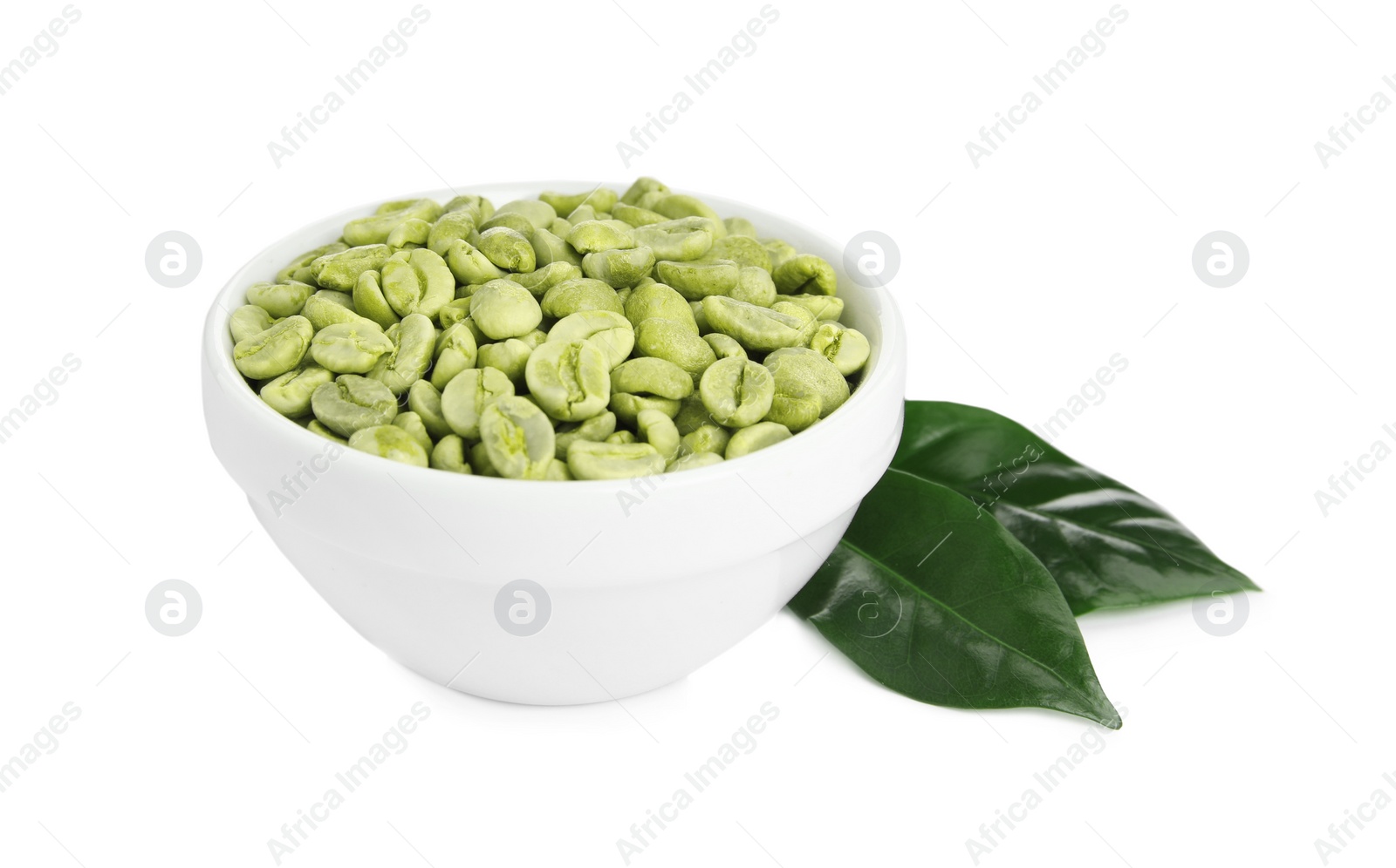 Photo of Bowl with green coffee beans and fresh leaf on white background