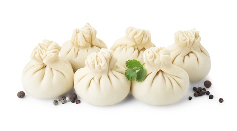 Uncooked khinkali (dumplings) and spices isolated on white. Georgian cuisine