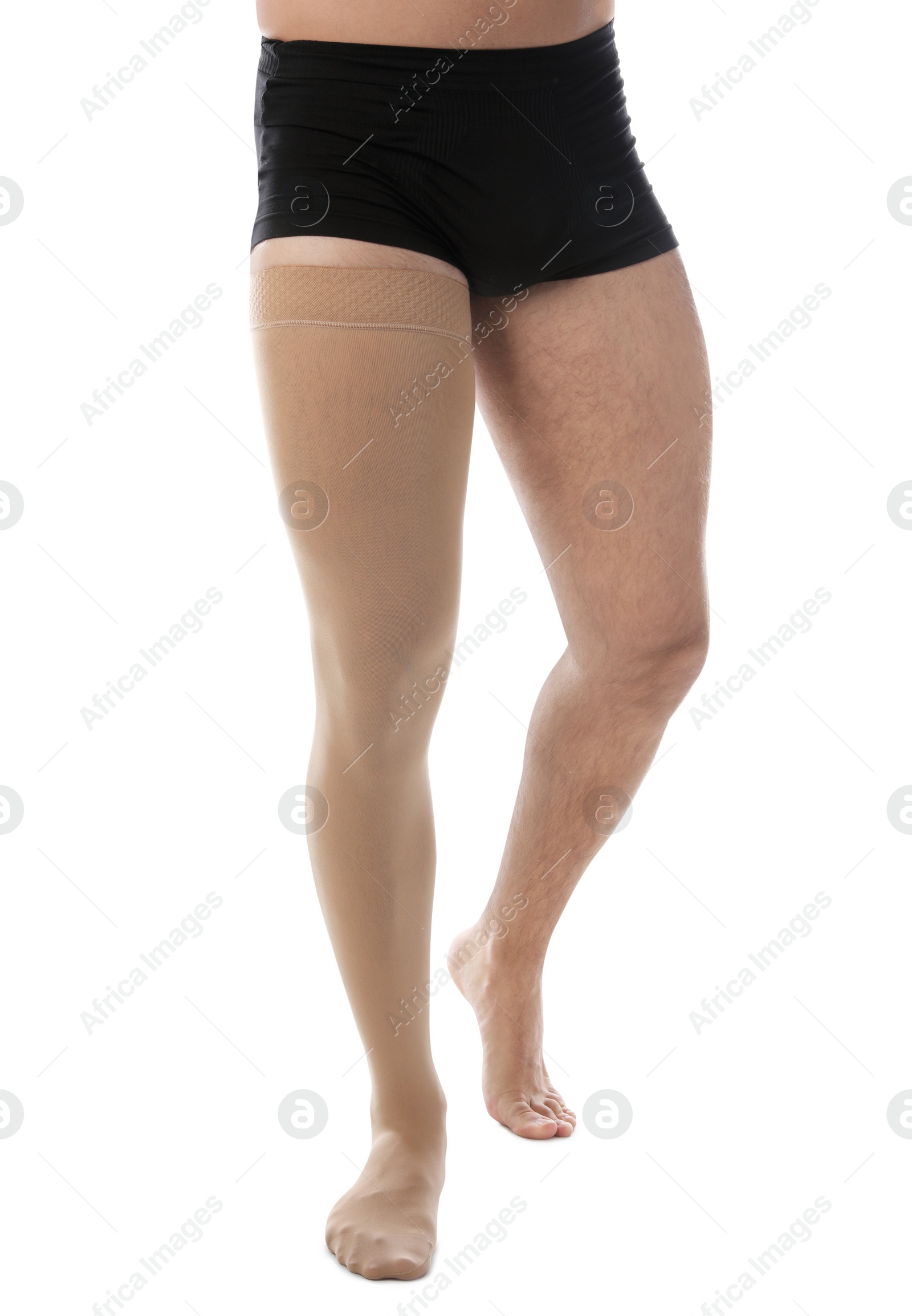Photo of Man wearing compression stocking isolated on white, closeup