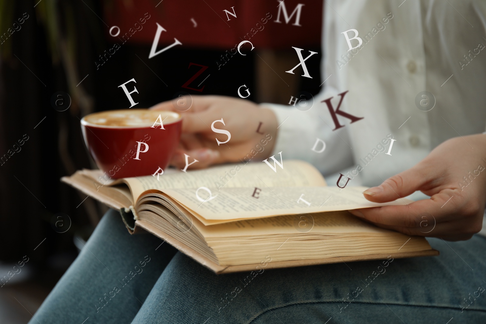 Image of Woman with cup of coffee reading book indoors, closeup. Letters over book