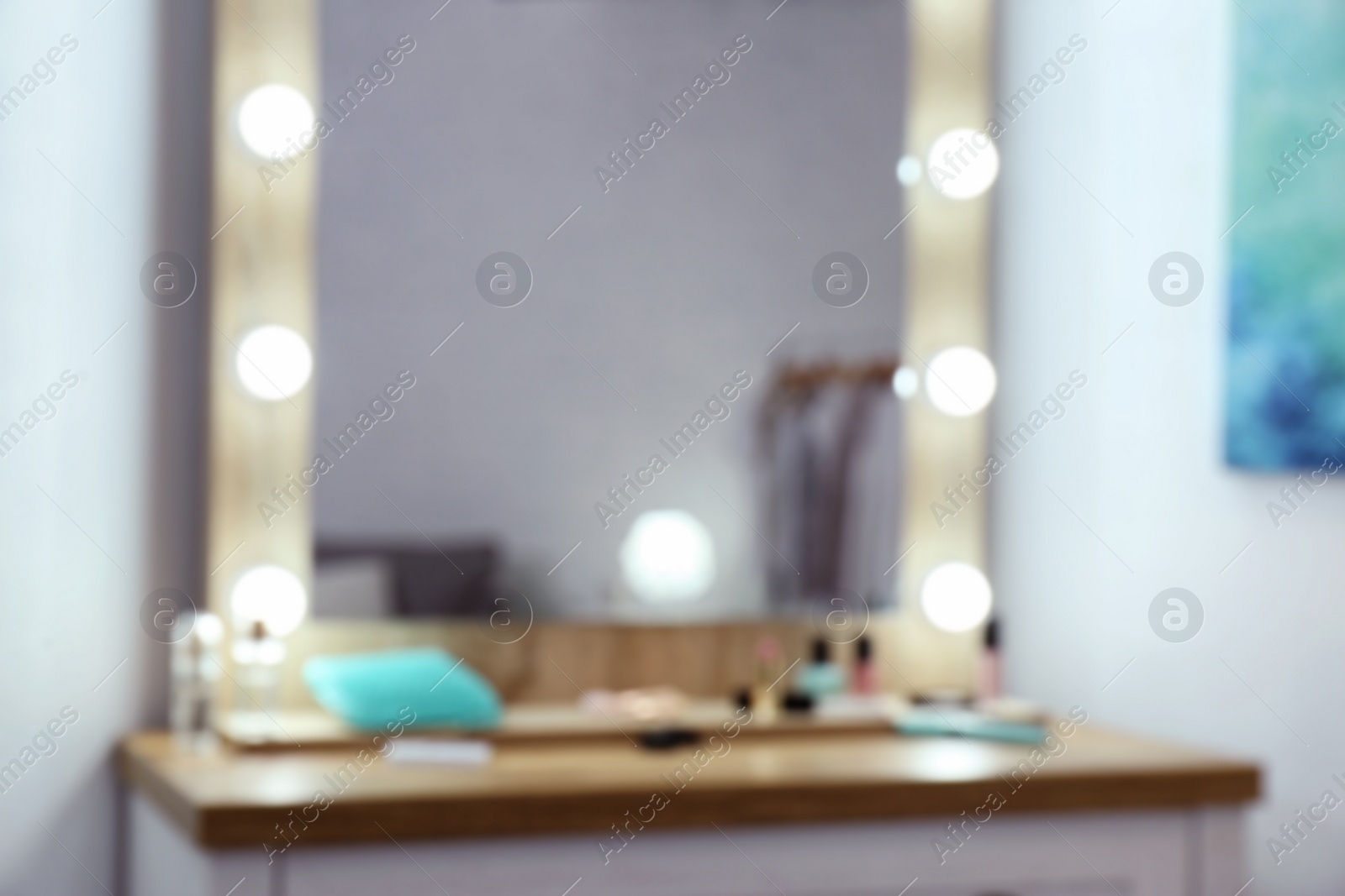 Photo of Blurred view of makeup mirror on table in dressing room