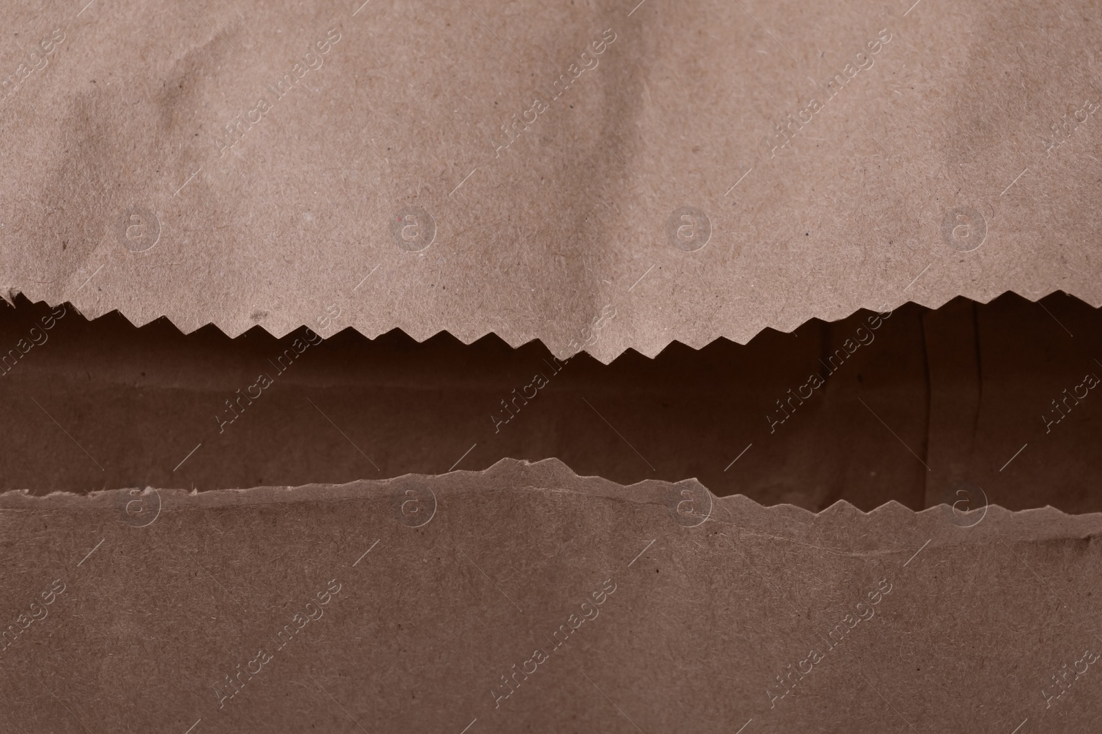 Photo of Open kraft paper bag as background, closeup