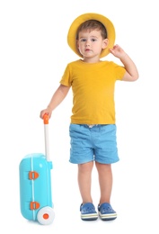 Cute little boy with hat and blue suitcase on white background