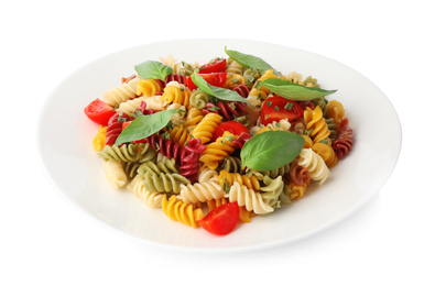 Photo of Colorful pasta with basil and cherry tomatoes isolated on white