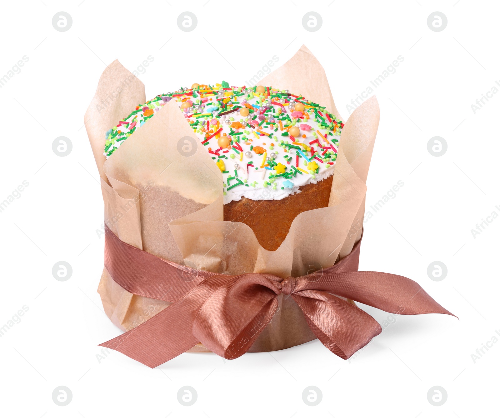 Photo of Traditional Easter cake with sprinkles wrapped in parchment paper with ribbon isolated on white