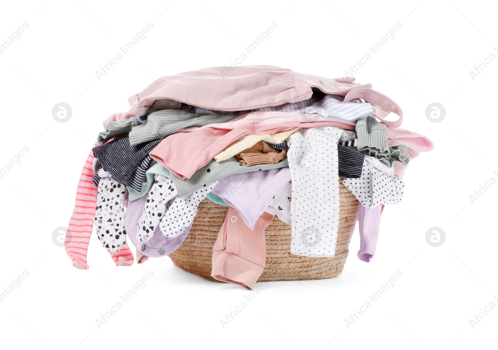 Photo of Laundry basket with baby clothes isolated on white